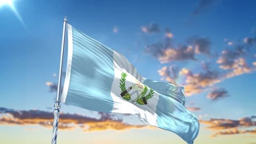 Guatemala Flag Waving Against Blue Sky With Clouds