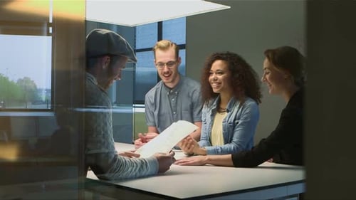 Business Team Meeting Reviewing Documents in Office