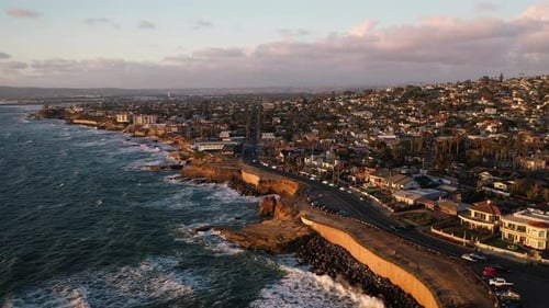 Static aerial at sunset of Sunset Cliffs looking towards Ocean Beach in San Diego