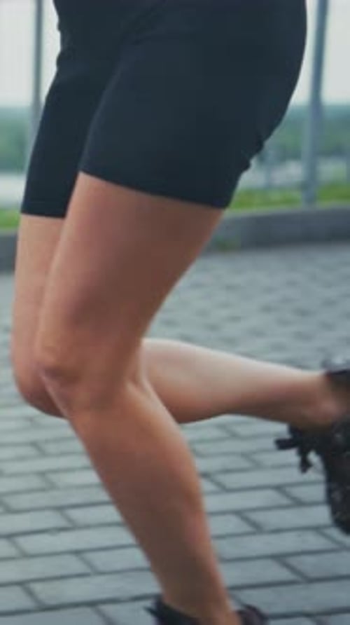 Athletic Woman Runs in the City