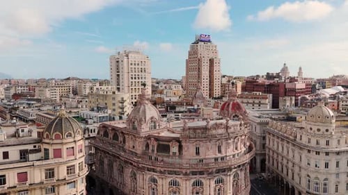 Historic architecture and modern skyline in genoa on a bright day with clear skies, aerial view