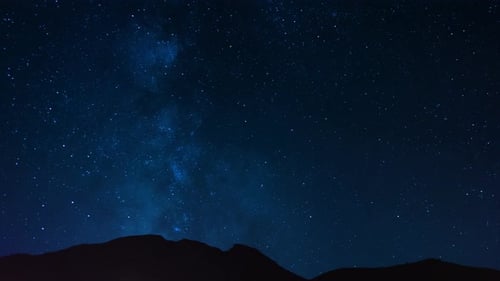 Time lapse of a starry night sky clouds