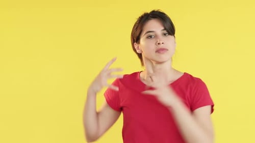 Woman Gesturing Angrily in Studio Setting