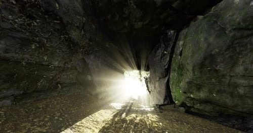 Sunlight Streaming Through a Narrow Passage in a Rocky Landscape at Midday
