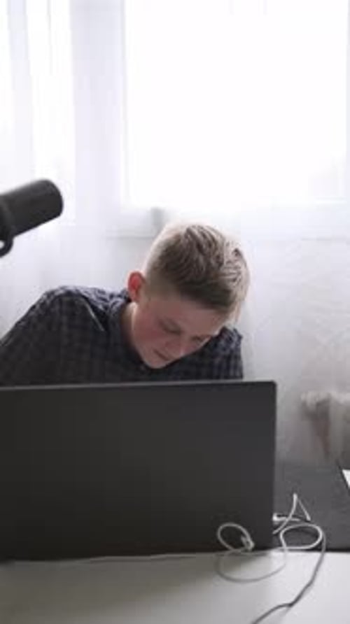 Teenager Studying Online with Laptop and Notebook Distance Learning and Education at Home