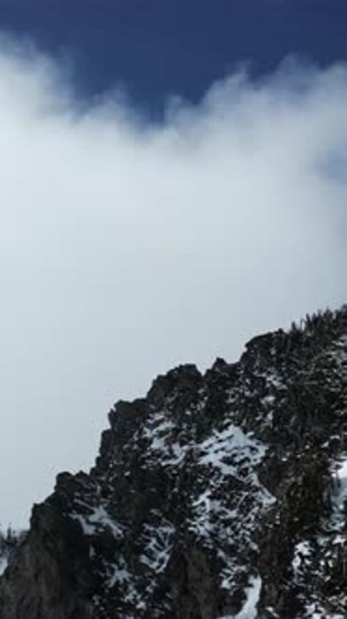 Snowy Mountain Peaks And Clouds. British Columbia, Canada.