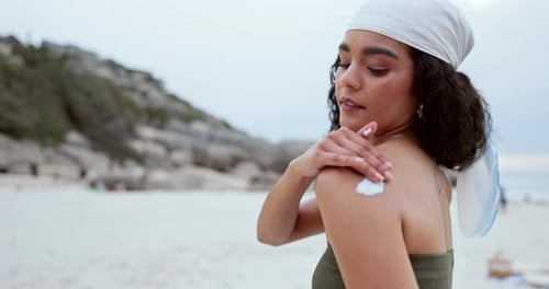 Happy woman, beach and sunscreen on shoulder for skincare, beauty and healthy wellness on vacation