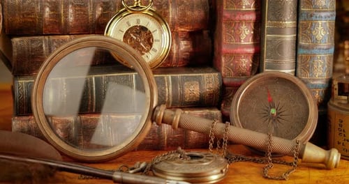 Vintage Compasses and Books on Antique Map