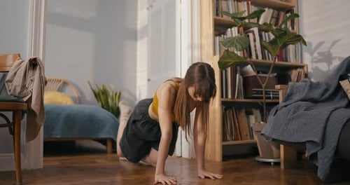 Woman Doing Glute Exercise in Her Apartment