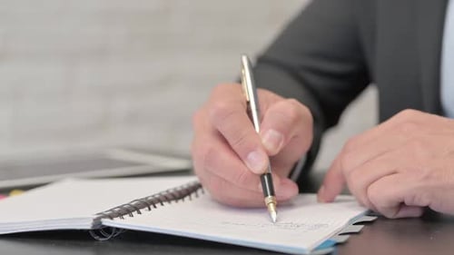 Close Up of Businessman Writing a Letter, Paperwork