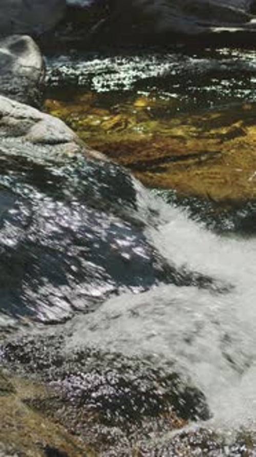 Pure, sparkling, bubbling and cascading water of nearby stream close up.