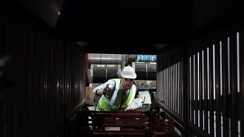 Male engineer metal worker industrial experienced operator technician worker checked