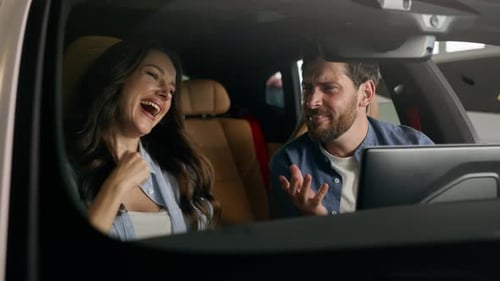 Happy Couple Singing in Car