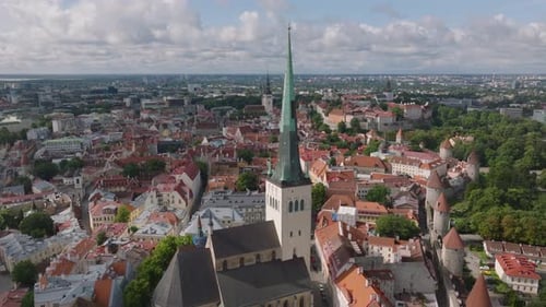 Aerial View of Tall Church Tower and Historic Houses in Old Town Medieval Tourist Sight Oleviste