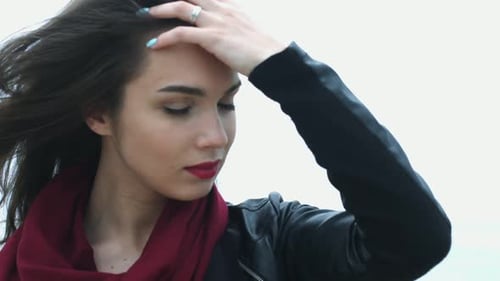 Beautiful Woman Face with Red Sexy Lips and Brunette Hair. Close Up