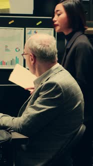 Colleagues Collaborate with Tablet in Dim Workplace, People Stock ...