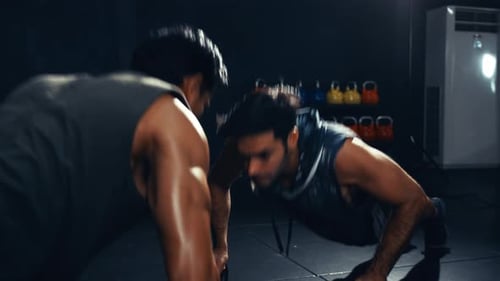 Sportsman workout together exercise crossfit in the fitness gym