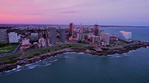 Panoramic Pan View over Mar Del Plata Waterfront and San Martin Park at Sunset