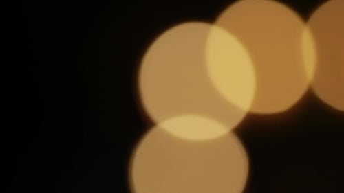 Abstract isolated blurred festive yellow orange lights with bokeh. Holiday concept backdrop with twi