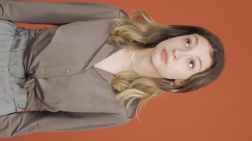 Young Woman Making Facial Expressions in Vertical Portrait