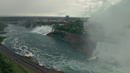 Niagara Falls Shrouded in Mist and Clouds Drone Shot