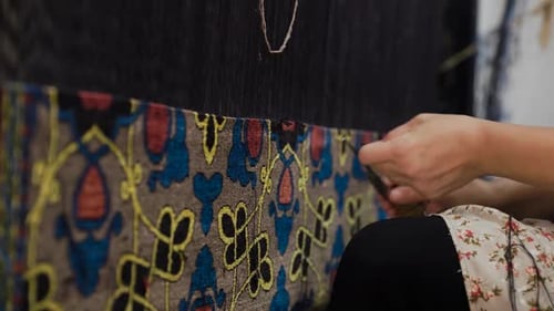 Woman Hands Weaving Carpet in Uzbekistan