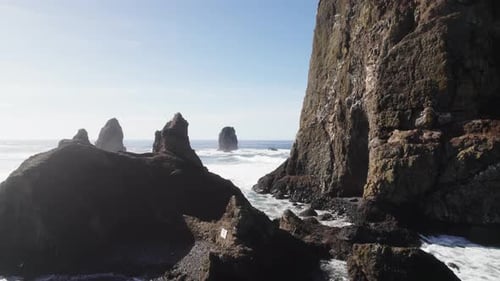 Flight between rocks of Haystack Rock formation at Cannon Beach