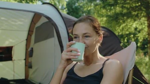 Woman Enjoying Camping and Relaxing Outdoors