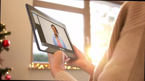 Woman video chatting during the Christmas season