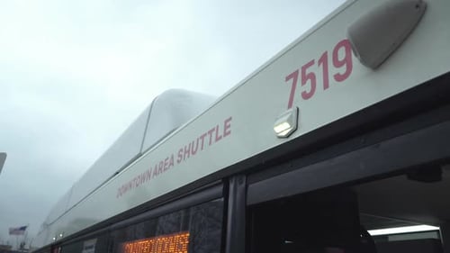 close up of a downtown area shuttle bus