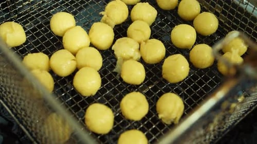 Round Balls Being Deep Fried