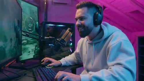 Man Playing Video Game in Colorful Room