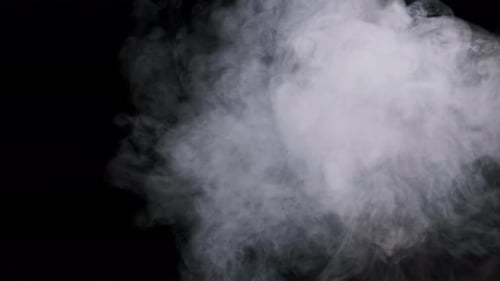 White Smoke on a Black Background in Slow Motion Explosion Steam