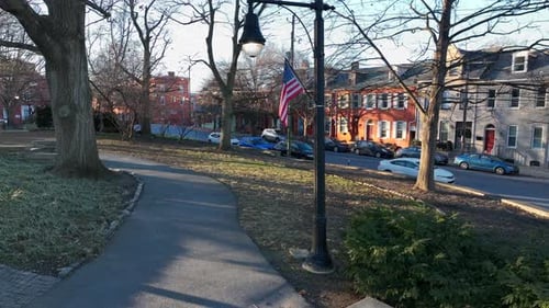 Quiet Neighborhood Street with American Flag