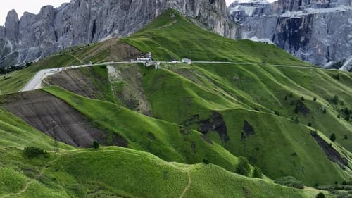 Sella Pass in summer season, Dolomites in Italy. Aerial forward tilt-up reveal