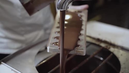 Pouring Melted Into Molds - Close Up