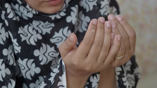 Woman in Hijab Praying with Hope and Faith