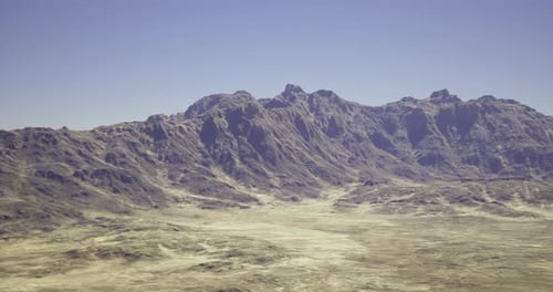 Majestic Mountain Range Overlooking Vast Arid Landscape Under Clear Blue Sky
