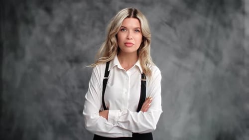 Confident Young Woman in White Shirt Posing