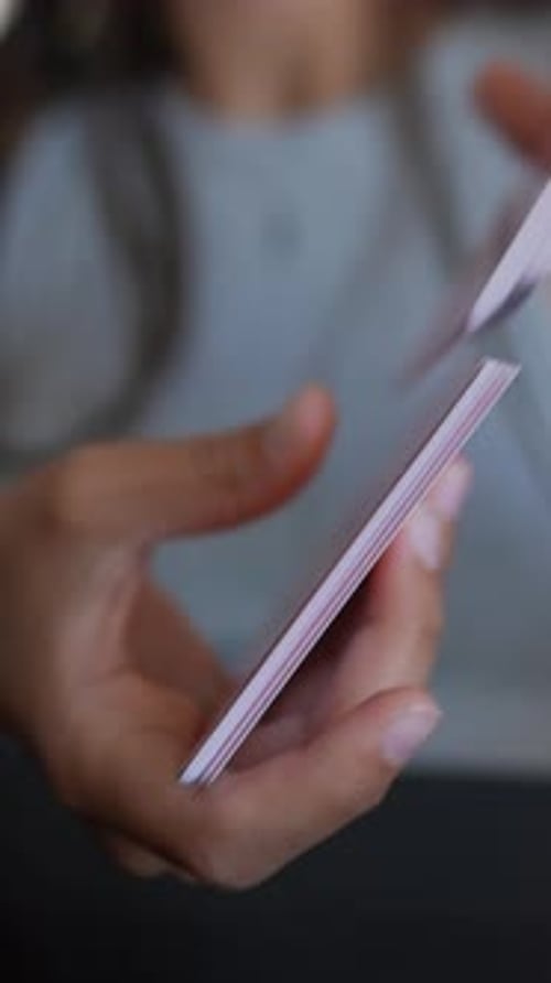 Close Up of Hands Shuffling Cards