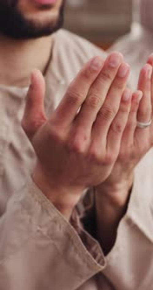 Man with Beard Praying Indoors