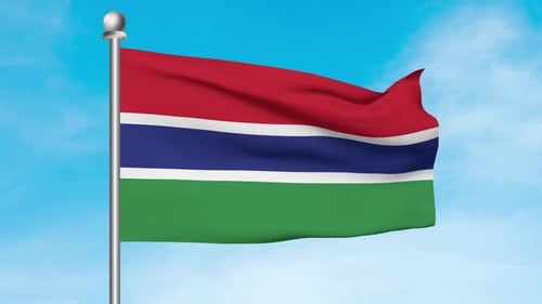 Realistic Gambian Flag Waving on Pole with Blue Sky