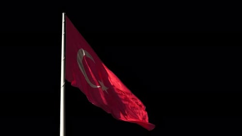 Dynamic Waving Red Flag Animation Against Black Background