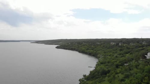 The Dnipro river aerial view drone flying over the ukrainian vilage