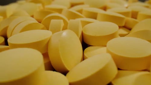 Pills and Vitamins Macro Close Up View of Womans Hands Holding Plenty of Different Drugs Painkillers