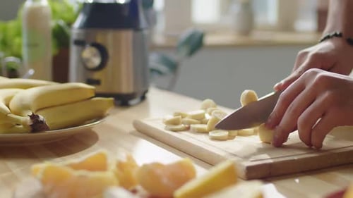 Cutting Banana Slices for a Healthy Smoothie