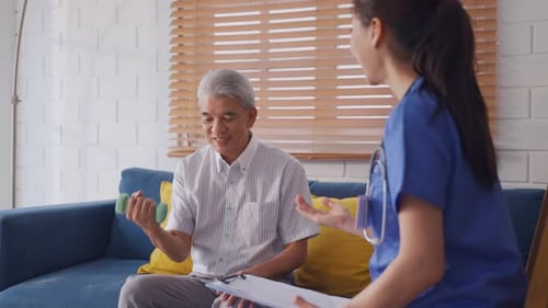Senior Man Doing Physical Therapy With a Healthcare Worker