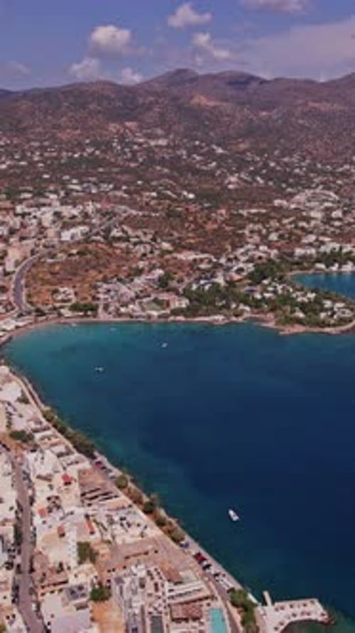 Aerial view of a coastal town in Greece during a sunny day