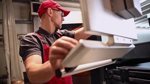 Metal Laser Cutter Operator Using Built In Touch Screen Display