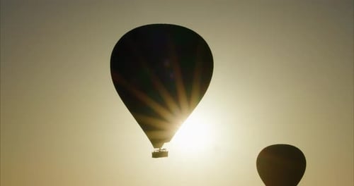 Sun shining behind a hot air balloon, Cappadocia, Turkey
